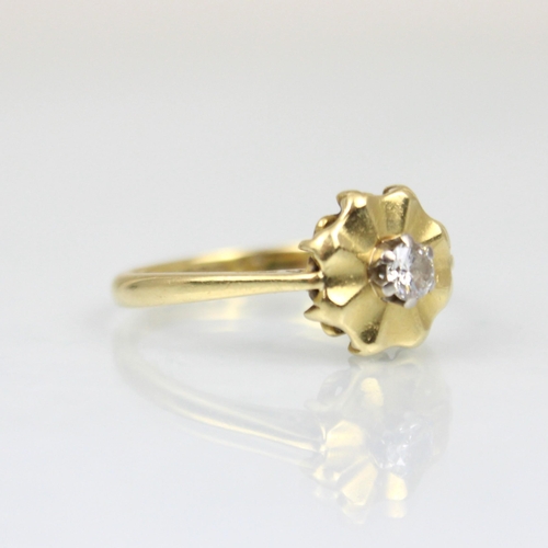 211 - An 18ct diamond cluster ring, the central round cut diamond within a yellow gold stylised flowerhead... 