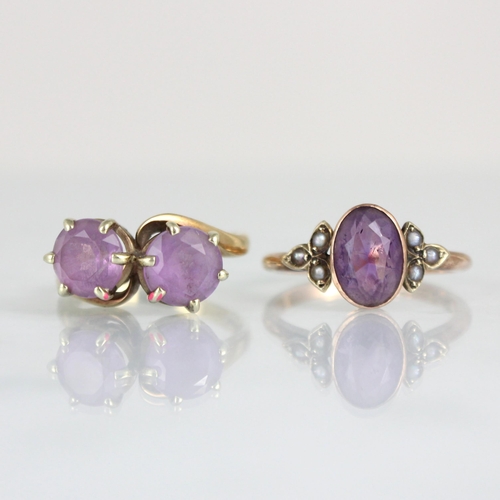 226 - An early 20th century 9ct amethyst ring, the central oval cut stone with seed pearl set trefoil shou... 