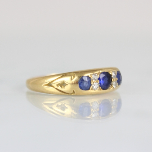 230 - An early 20th century diamond and untested sapphire ring, the central cushion cut stone with old cut... 