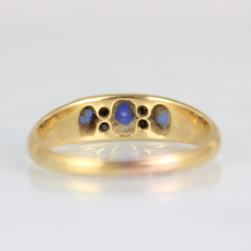 230 - An early 20th century diamond and untested sapphire ring, the central cushion cut stone with old cut... 