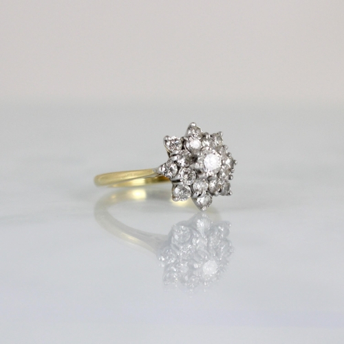 233 - A mid 20th century diamond cluster ring, the raised central round cut diamond within double surround... 