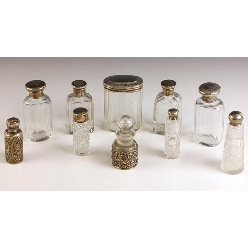 25 - A selection of silver mounted items, including a Victorian silver mounted scent bottle, Arthur Willm... 