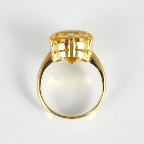 257 - A bespoke untested yellow sapphire cocktail ring, possibly Sri Lankan, the fancy oval cut stone with... 