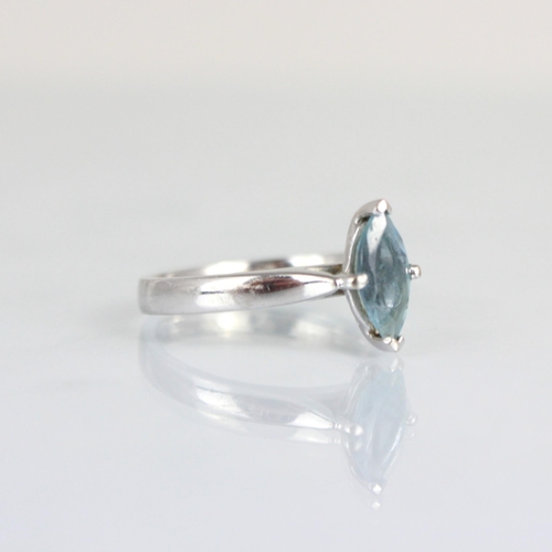 262 - A bespoke aquamarine solitaire ring, the marquise cut aquamarine within 18ct white metal claw settin... 