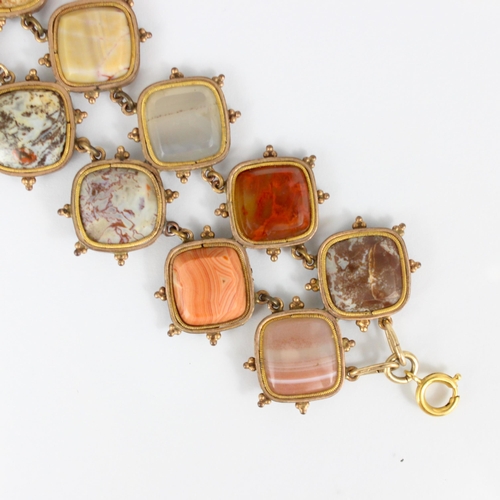 267 - A 19th century banded agate bracelet, the fourteen shaped panels within a gold plated rub over style... 