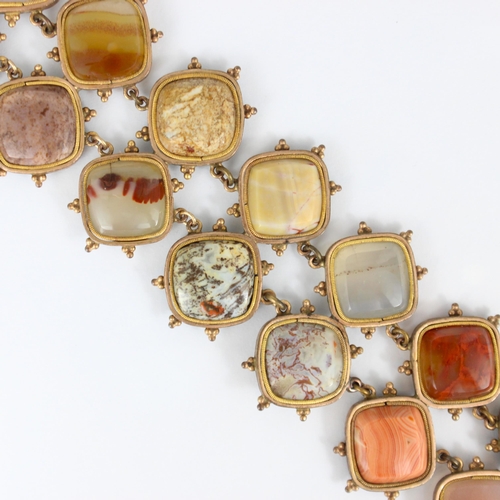 267 - A 19th century banded agate bracelet, the fourteen shaped panels within a gold plated rub over style... 