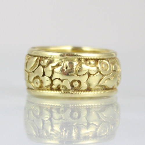 273 - A 19th century yellow metal ring, with continuous floral design, engraved to interior ‘JB to AJB 188... 