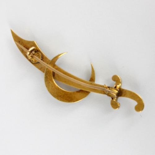 281 - A 19th century yellow metal pearl set brooch, designed as a sword within crescent moon, set with gra... 