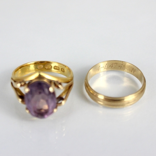 285 - A 22ct amethyst dress ring, the wedding band converted to hold oval cut amethyst, with split shoulde... 