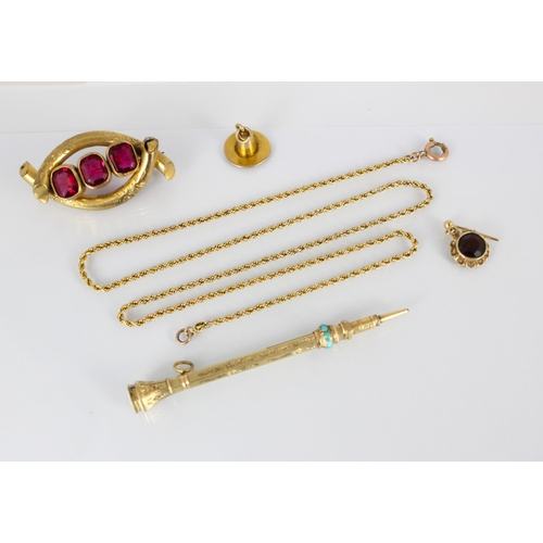 295 - A selection of yellow metal and gold coloured jewellery, including a 9ct yellow gold charm, designed... 