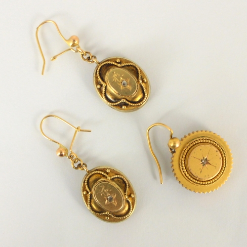 296 - A pair of 19th century yellow metal earrings, the oval drop earrings with raised diamond set centre ... 