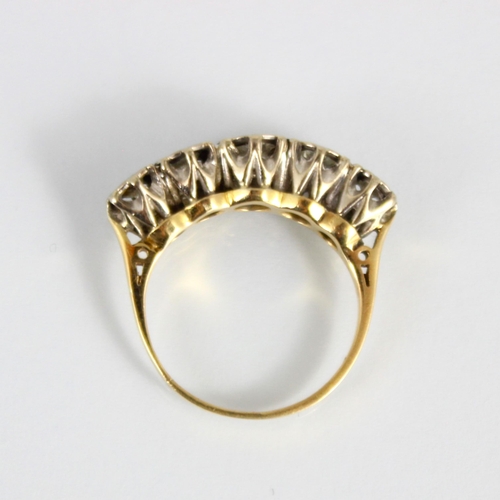 308 - A mid 20th century diamond five stone ring, the graduated round cut diamonds within white metal illu... 