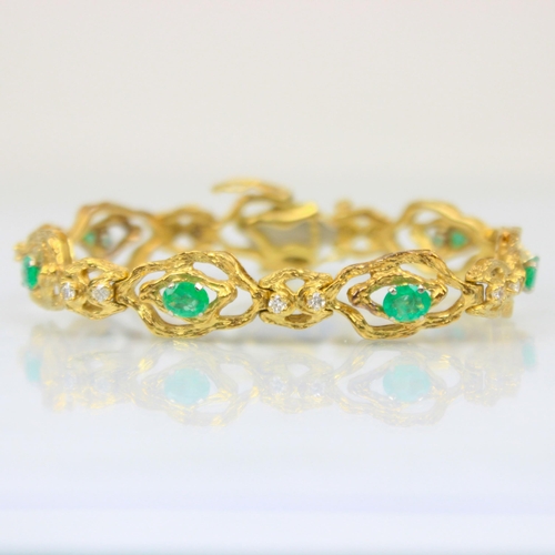 324 - An 18ct yellow gold emerald and diamond bracelet, in the Brutalist style, the seven oval organic sha... 