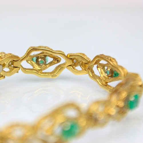 324 - An 18ct yellow gold emerald and diamond bracelet, in the Brutalist style, the seven oval organic sha... 