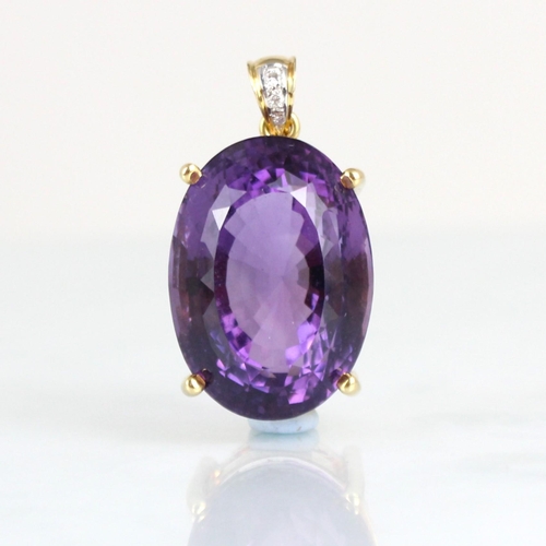 330 - An amethyst and diamond pendant, the oval cut amethyst within a yellow metal mount, with diamond set... 