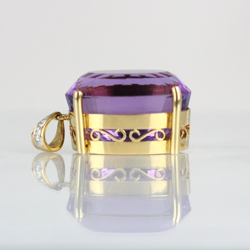 330 - An amethyst and diamond pendant, the oval cut amethyst within a yellow metal mount, with diamond set... 