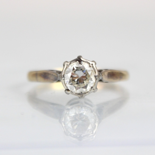 331 - A mid 20th century diamond solitaire ring, the round cut diamond within white metal illusion setting... 