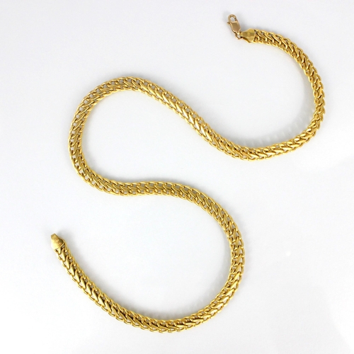 337 - A yellow metal chain, the stylised curb link chain with lobster fastener, stamped '750' with import ... 