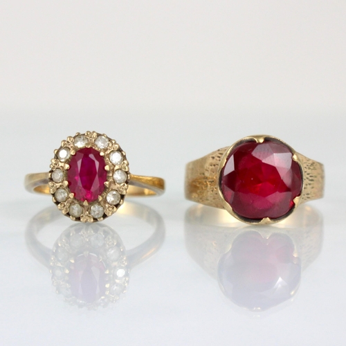 340 - A 9ct synthetic ruby ring, the round cut red stone within claw setting edge, leading to engraved sho... 