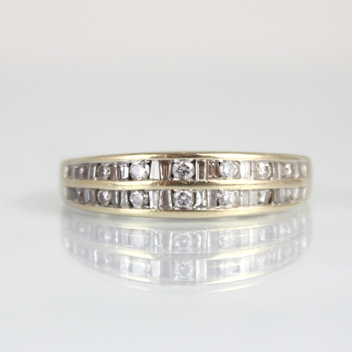 347 - A white metal diamond half eternity, the baguette, round and fancy cut diamonds channel set in white... 