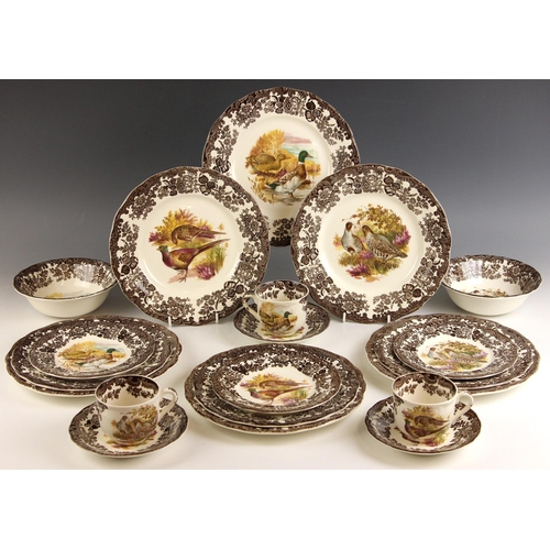 570 - HUNTING INTEREST: A Royal Worcester Group Palissy part dinner service in the 'Game Series' pattern, ... 