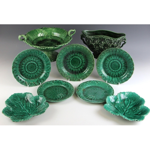 573 - Six Wedgwood green glazed desert plates relief moulded in the 'Sunflower' pattern, mid 19th century,... 