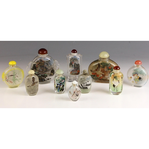 588 - A collection of ten Chinese reverse painted snuff bottles, each painted with various scenes includin... 