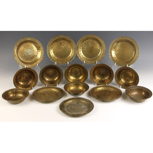 598 - A set of eight Indian brass finger bowls, 19th century, each of circular form with hammered decorati... 