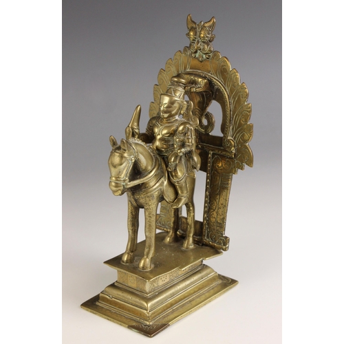 603 - An Indian brass model of khandoba (Shiva) and Mhalsa (Parvati) on horse back, late 19th century, wit... 