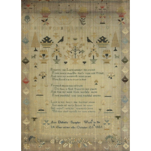 605 - An early George IV needlework sampler, worked by Ann Dicketts, aged fourteen years, the central vers... 