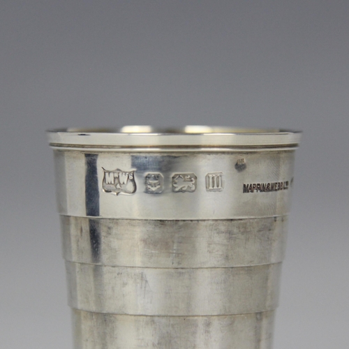 61 - A George V silver beaker, Mappin and Webb, Birmingham 1911, the collapsible tapered beaker with gilt... 