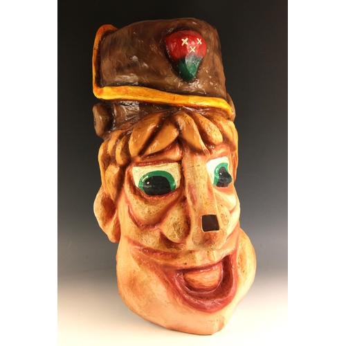 624 - A Dutch carnival head, late 20th century, polychrome painted papier mache, viewing hole to the nose,... 