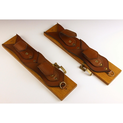 628 - Two pairs of leather gun hooks, mid to late 20th century, modelled in the manner of Jacques Adnet's ... 