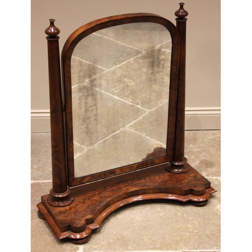 666 - A Victorian figured mahogany dressing mirror, of Country House proportions, the twin tapering cylind... 