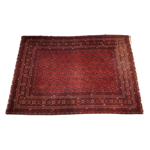 684 - A Caucasian Seychur type rug, in red, black and ivory colourways, the central field with an all over... 