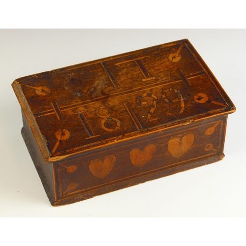 694 - A 19th century folk art box, the hinged cover inlaid with the initials and year 'C.T 1829', over a f... 