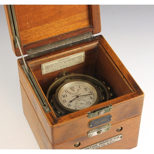 707 - An American WWII Hamilton marine chronometer watch, Model 22, circa 1943, the two tier mahogany box ... 