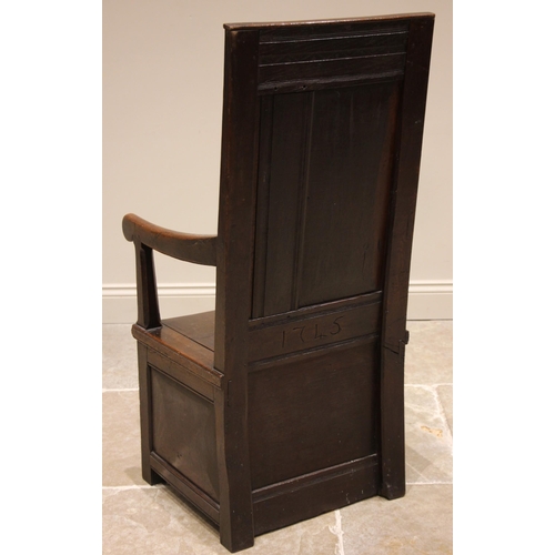 719 - An 18th century and later oak box seat Wainscot chair, the panelled back rest with a carved arcaded ... 