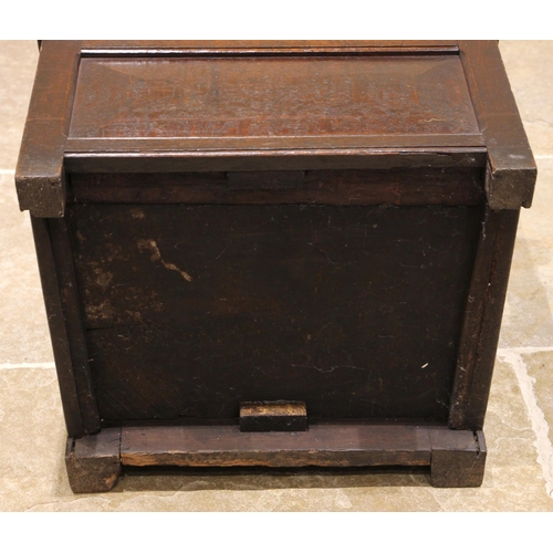 719 - An 18th century and later oak box seat Wainscot chair, the panelled back rest with a carved arcaded ... 