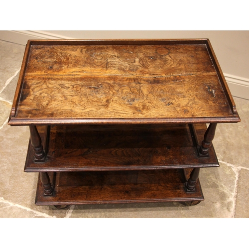 722 - A 19th century and later constructed pollard oak three tier drinks trolley, probably converted from ... 