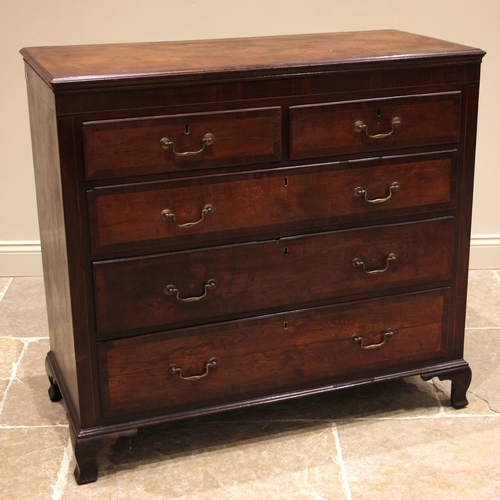 749 - A George III oak and mahogany crossbanded chest of drawers, formed with two over three lip moulded a... 