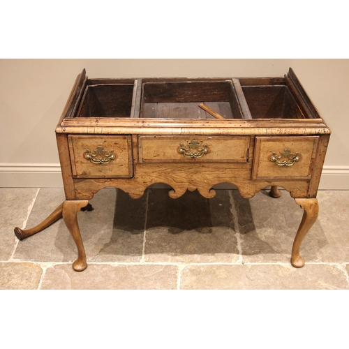 752 - A George I walnut chest on stand, the moulded cornice over an arrangement of two short and three gra... 