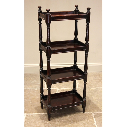 776 - A 19th century mahogany four tier whatnot, the galleried tiers supported upon turned baluster uprigh... 