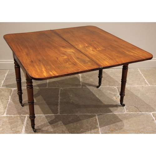 778 - A 19th century mahogany fold over side table, the rectangular folding top with rounded corners upon ... 