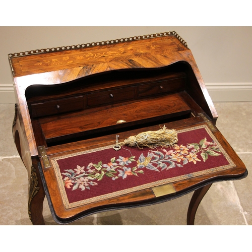 795 - A Louis XV revival rosewood and kingwood bureau de dame, late 19th century, the brass openwork galle... 