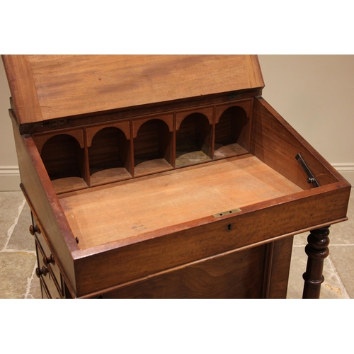 797 - A Victorian mahogany davenport, the rear gallery over a skiver inset slope opening to five arcaded p... 