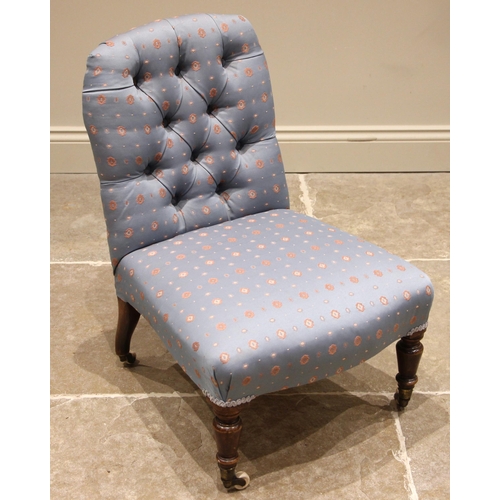 812 - A Victorian low seat chair, later re-covered in sky blue fabric, the button back over a serpentine s... 