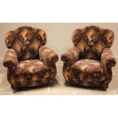 819 - A pair of 1930's armchairs, in brown velour 'landscape' fabric, each with a scalloped back rest and ... 