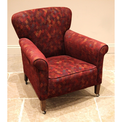 827 - An early 20th century armchair, later re-covered in harlequin pattern fabric, the gently arched back... 