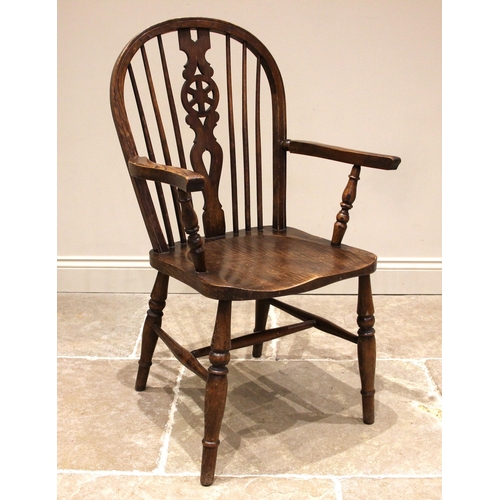 828 - A stained beech and elm wheelback Windsor elbow chair, 20th century, the hoop back over a shaped sea... 